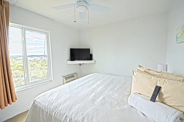 a view of a bathroom with sink and shower