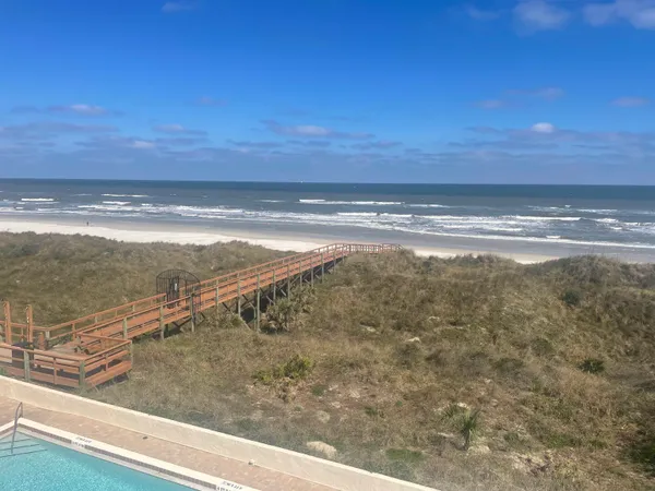 a view of a balcony with an ocean view