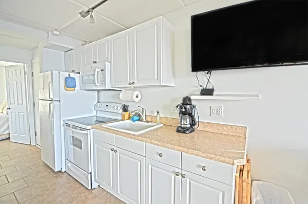 a kitchen that has a sink and a stove