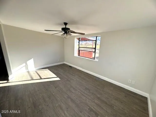 a bedroom with a bed dresser and a window