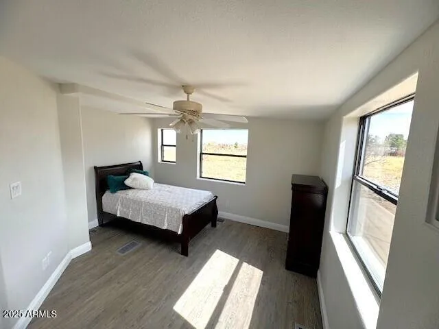 a bedroom with bed and window