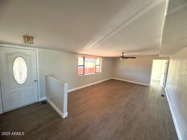 a living room with furniture potted plant and a window