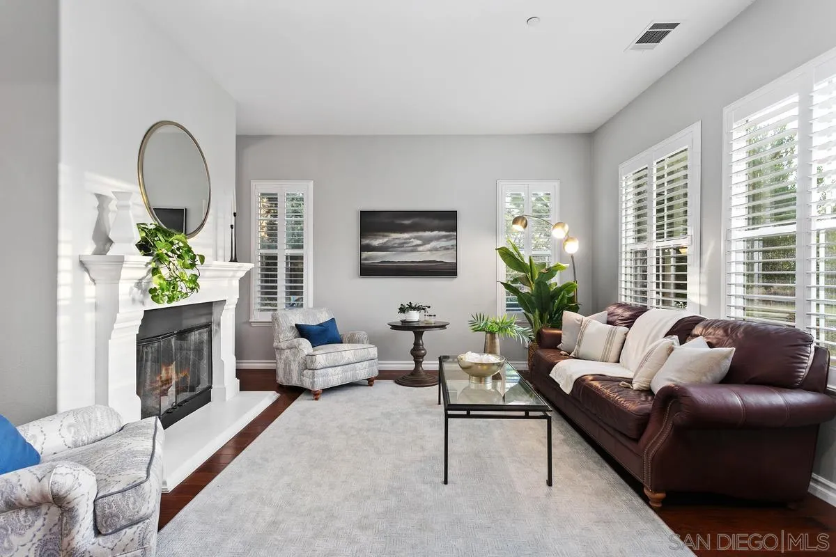 16309 Deer Ridge Road San Diego, CA 92127 - Photo 12 of 37 a living room with furniture a potted plant and a fireplace