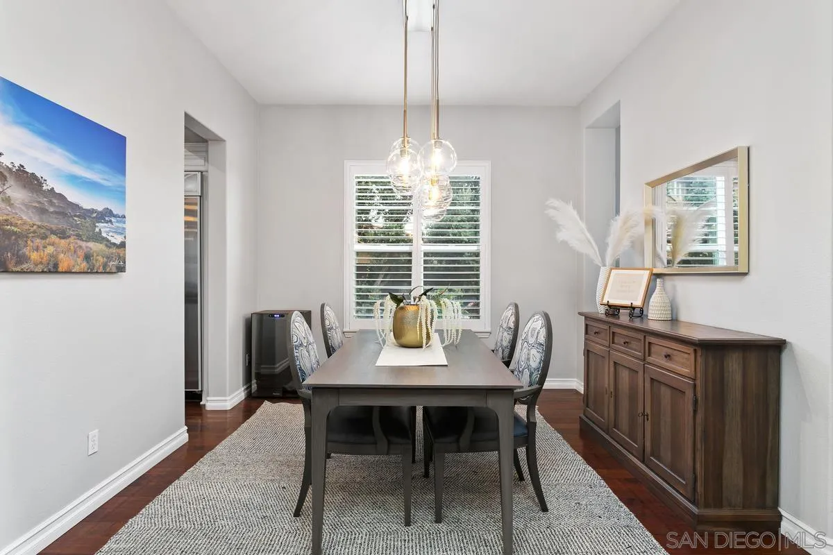 16309 Deer Ridge Road San Diego, CA 92127 - Photo 14 of 37 a dining room with furniture a rug and a chandelier