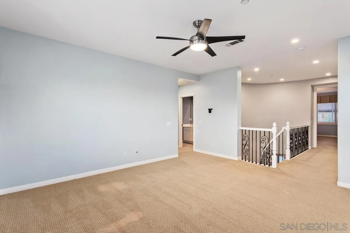 16309 Deer Ridge Road San Diego, CA 92127 - Photo 26 of 37 an empty room with closet and windows