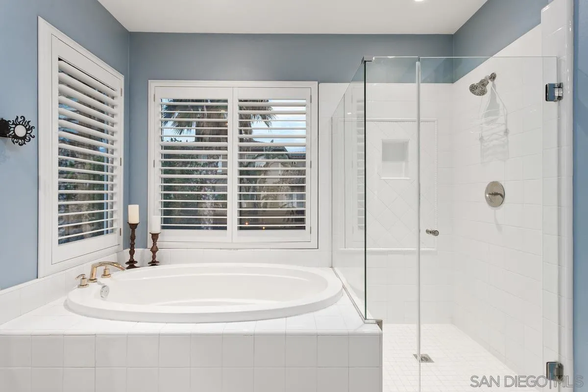 16309 Deer Ridge Road San Diego, CA 92127 - Photo 29 of 37 a bathroom with a bathtub and a shower