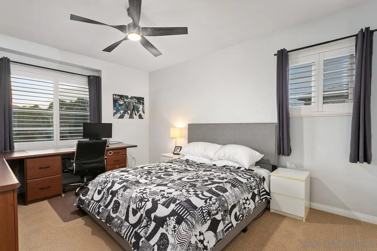 16309 Deer Ridge Road San Diego, CA 92127 - Photo 30 of 37 a bedroom with a bed and a table in it