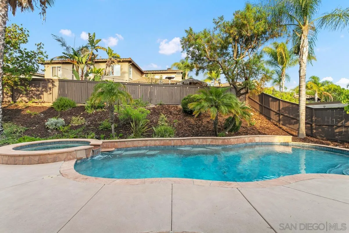 16309 Deer Ridge Road San Diego, CA 92127 - Photo 4 of 37 a view of a swimming pool with a patio