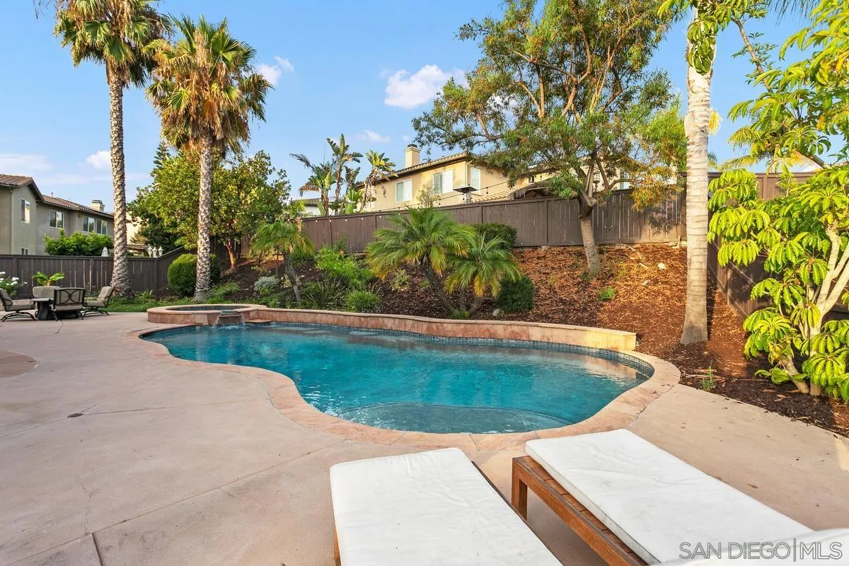 16309 Deer Ridge Road San Diego, CA 92127 - Photo 5 of 37 a view of a swimming pool with a patio