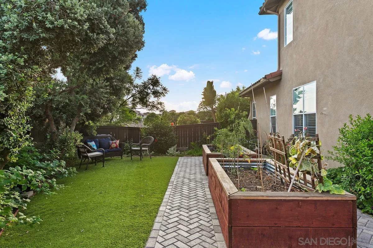 16309 Deer Ridge Road San Diego, CA 92127 - Photo 6 of 37 a front view of a house with garden