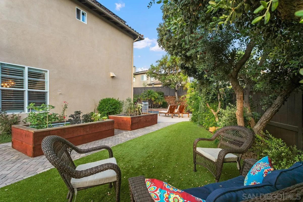 16309 Deer Ridge Road San Diego, CA 92127 - Photo 7 of 37 a view of a backyard with couches plants and large tree