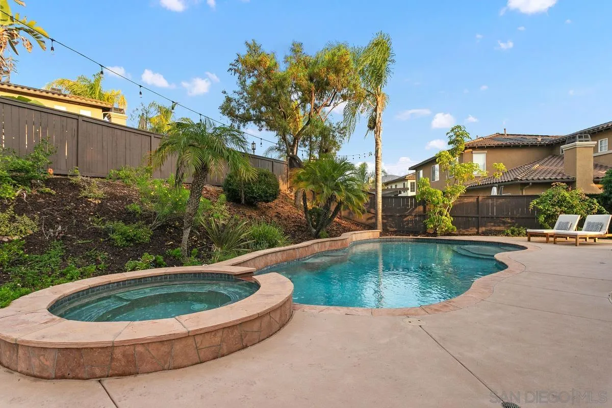 16309 Deer Ridge Road San Diego, CA 92127 - Photo 9 of 37 a view of a swimming pool with a yard