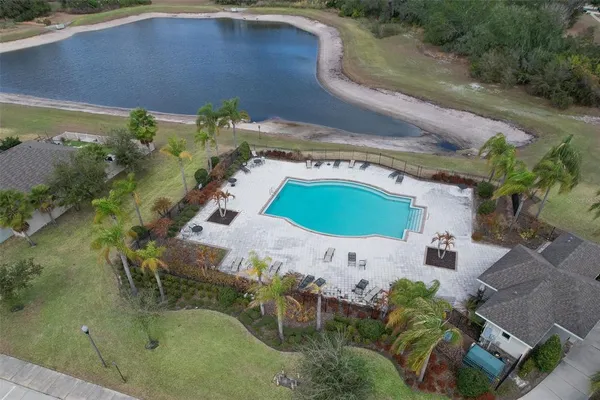 an aerial view of a house with a yard