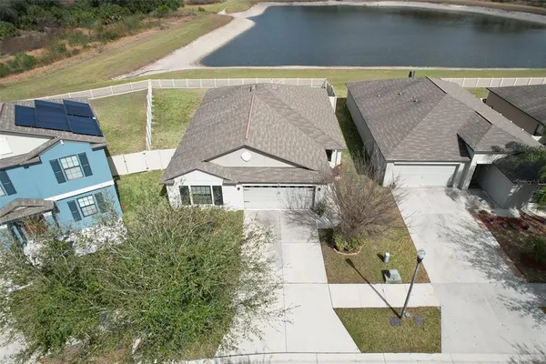 a aerial view of a house with a yard