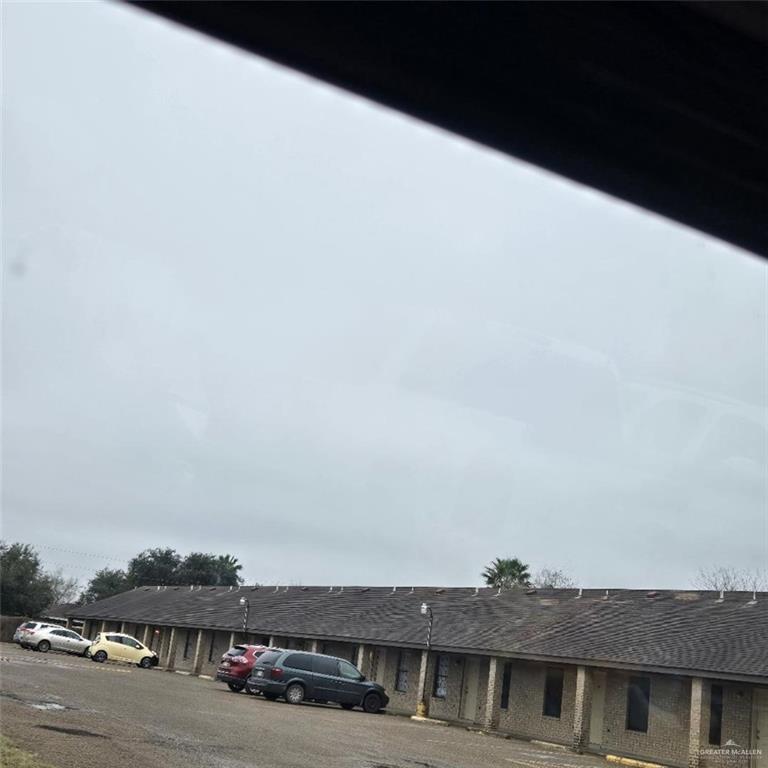 a view of a car parked in front of a building