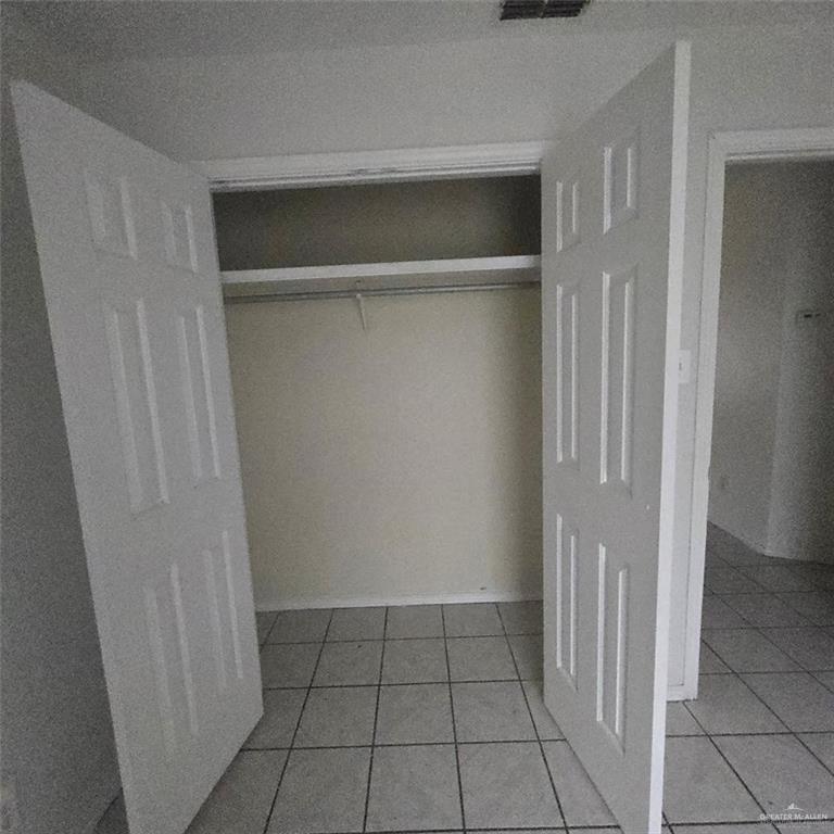 3915 South Alamo Road, Unit 20 Edinburg, TX 78542 - Photo 11 of 14 a view of an empty walk in closet