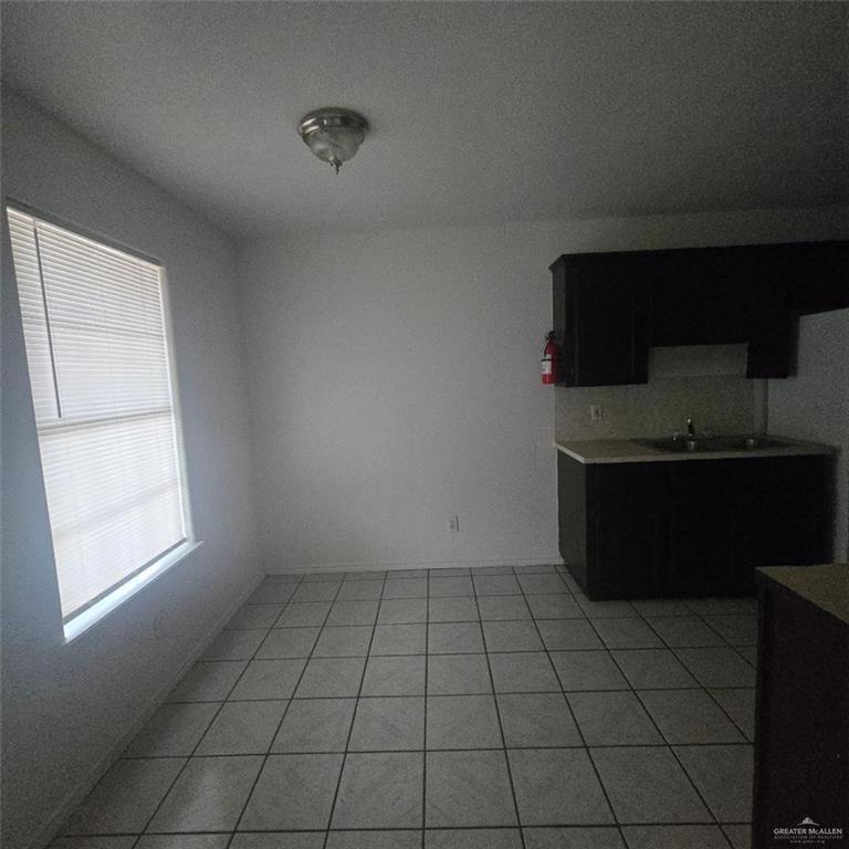 3915 South Alamo Road, Unit 20 Edinburg, TX 78542 - Photo 6 of 14 a kitchen with a sink