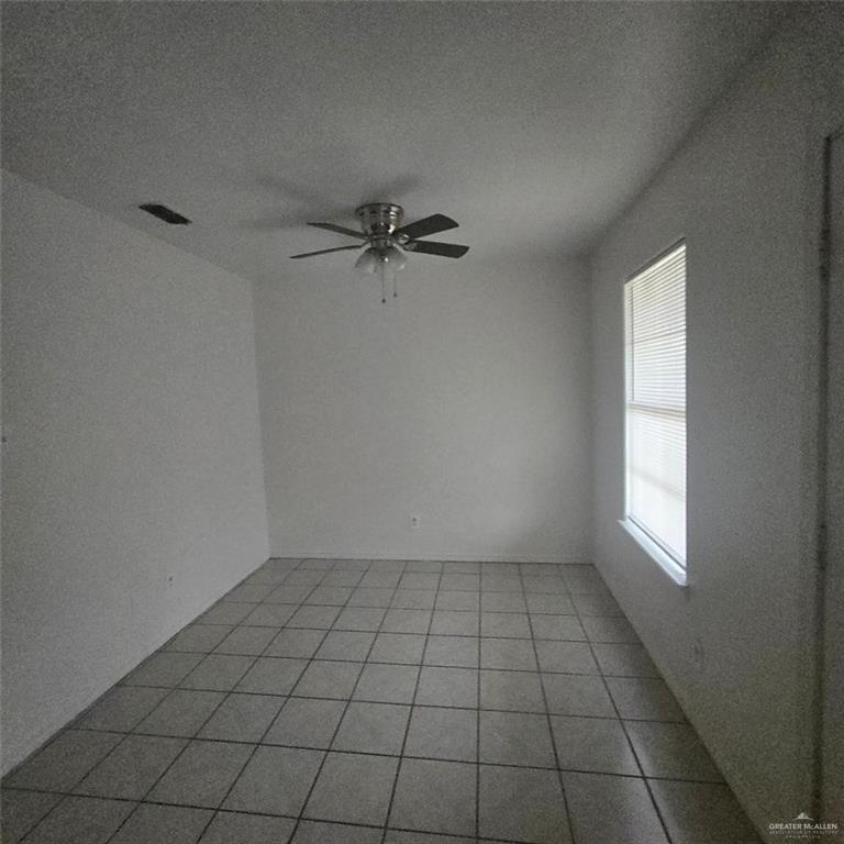 3915 South Alamo Road, Unit 20 Edinburg, TX 78542 - Photo 8 of 14 a view of an empty room and a window