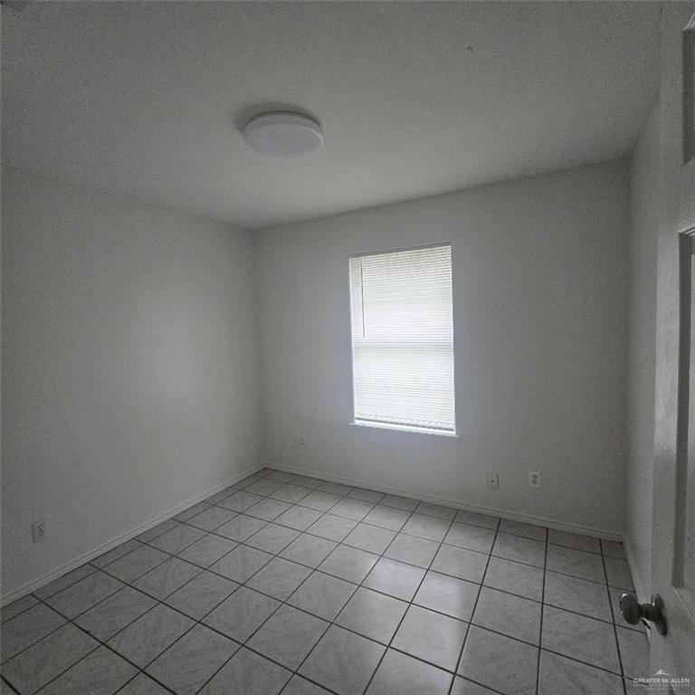 3915 South Alamo Road, Unit 20 Edinburg, TX 78542 - Photo 10 of 14 an empty room with windows