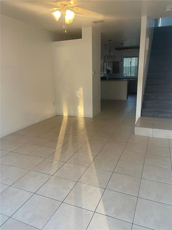 3860 Southwest 20th Avenue, Unit 1805 Gainesville, FL 32607 - Photo 2 of 10 a view of a refrigerator and window in a room