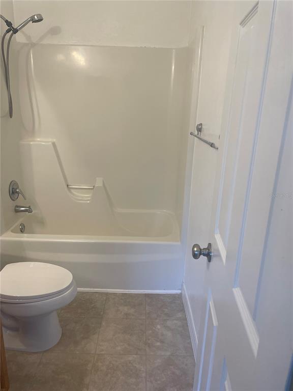 3860 Southwest 20th Avenue, Unit 1805 Gainesville, FL 32607 - Photo 8 of 10 a bathroom with a toilet and a shower