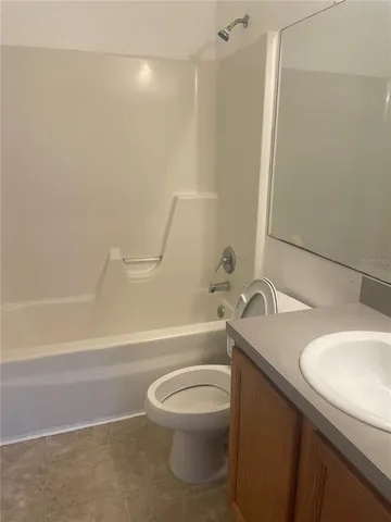a bathroom with a sink a toilet and a bathtub