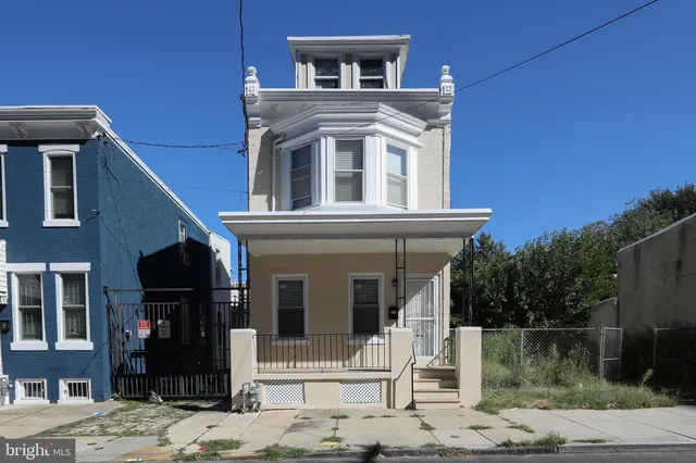 a front view of a house with a porch