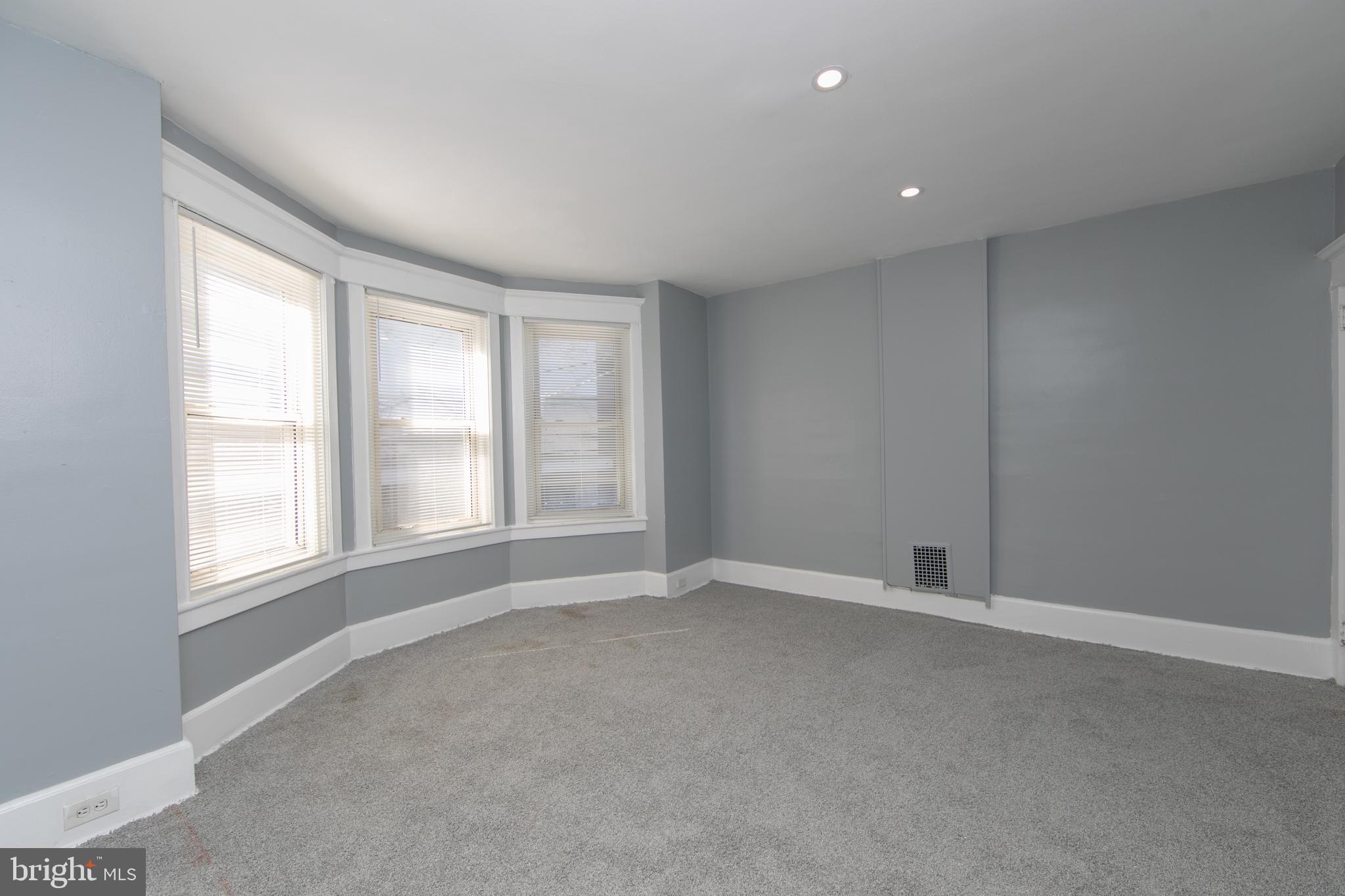 513 Benson Street Camden, NJ 08103 - Photo 16 of 37 an empty room with windows