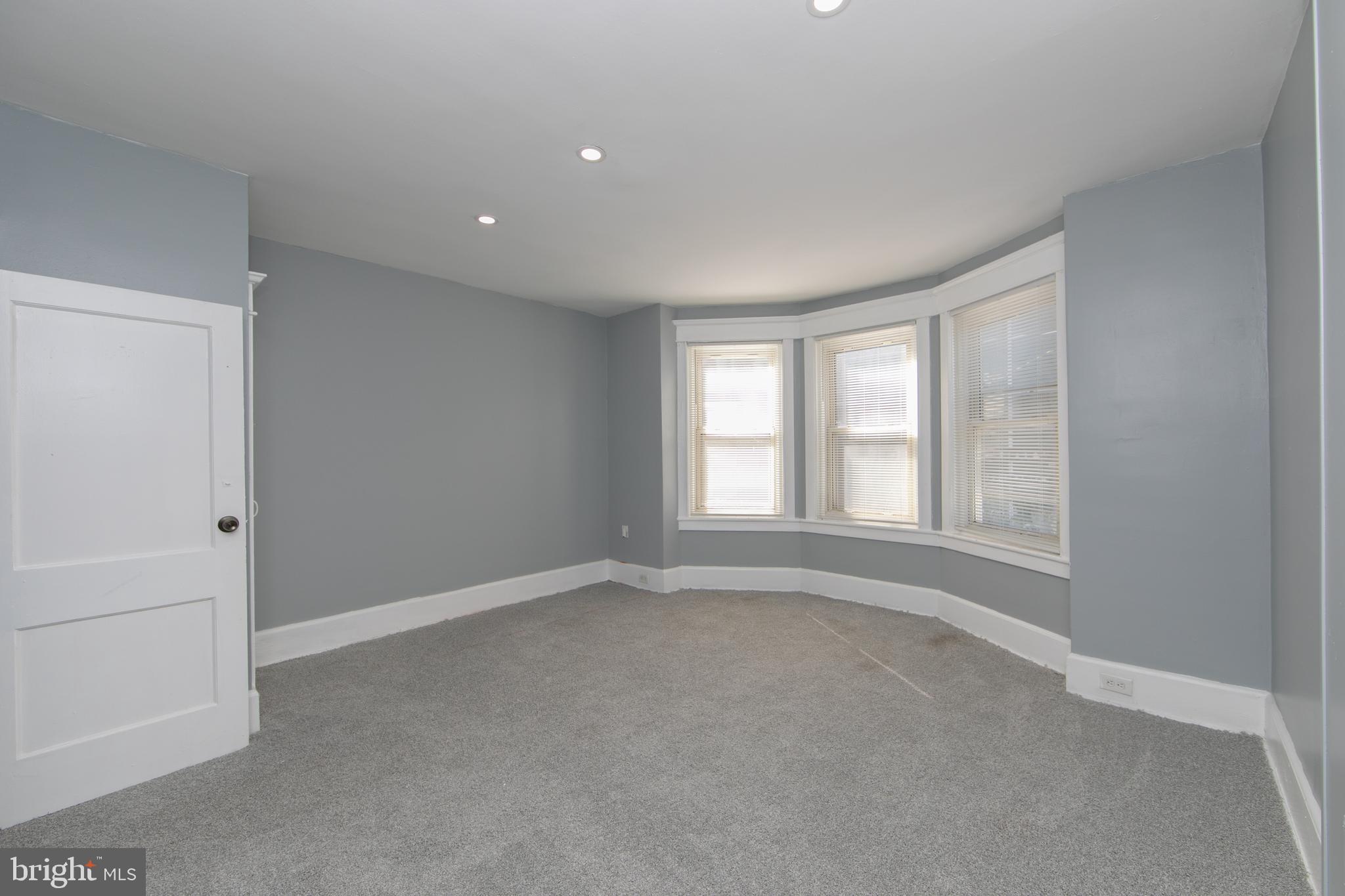 513 Benson Street Camden, NJ 08103 - Photo 17 of 37 a view of an empty room with a window