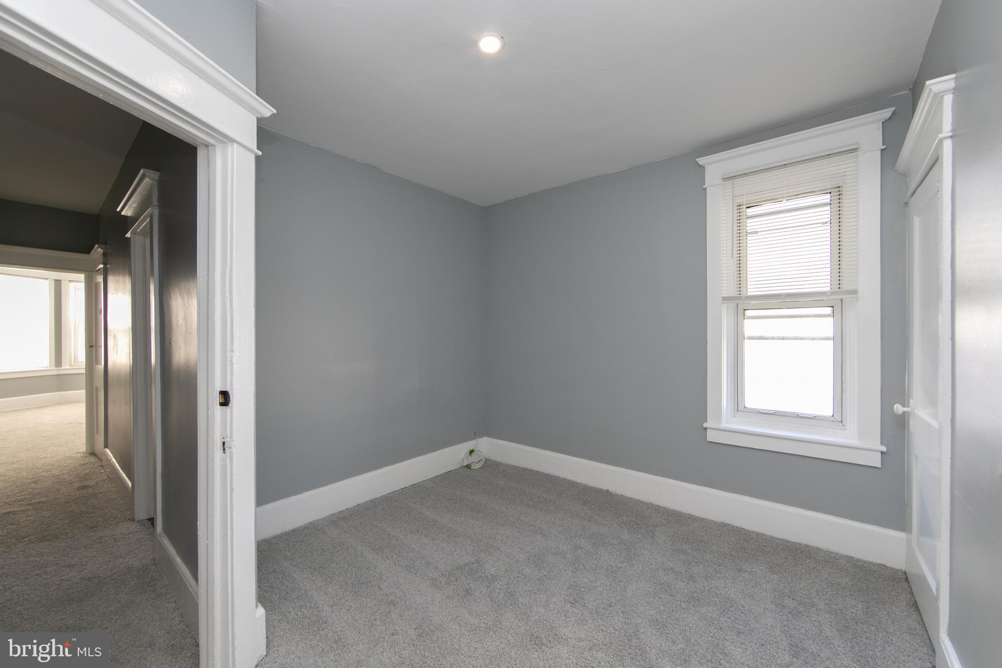 513 Benson Street Camden, NJ 08103 - Photo 20 of 37 an empty room with windows and closet