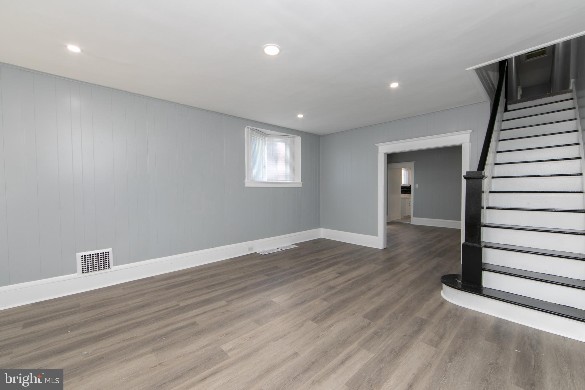 513 Benson Street Camden, NJ 08103 - Photo 2 of 37 wooden floor in an empty room with a window
