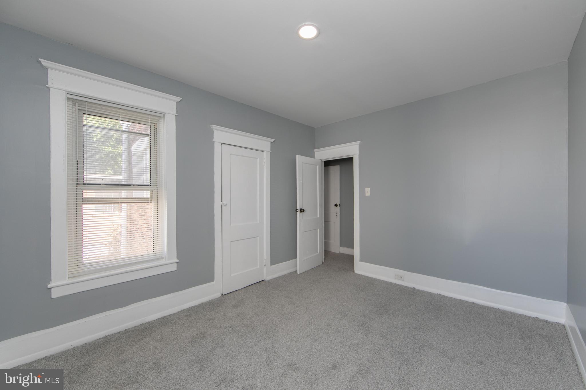 513 Benson Street Camden, NJ 08103 - Photo 25 of 37 an empty room with windows and closet