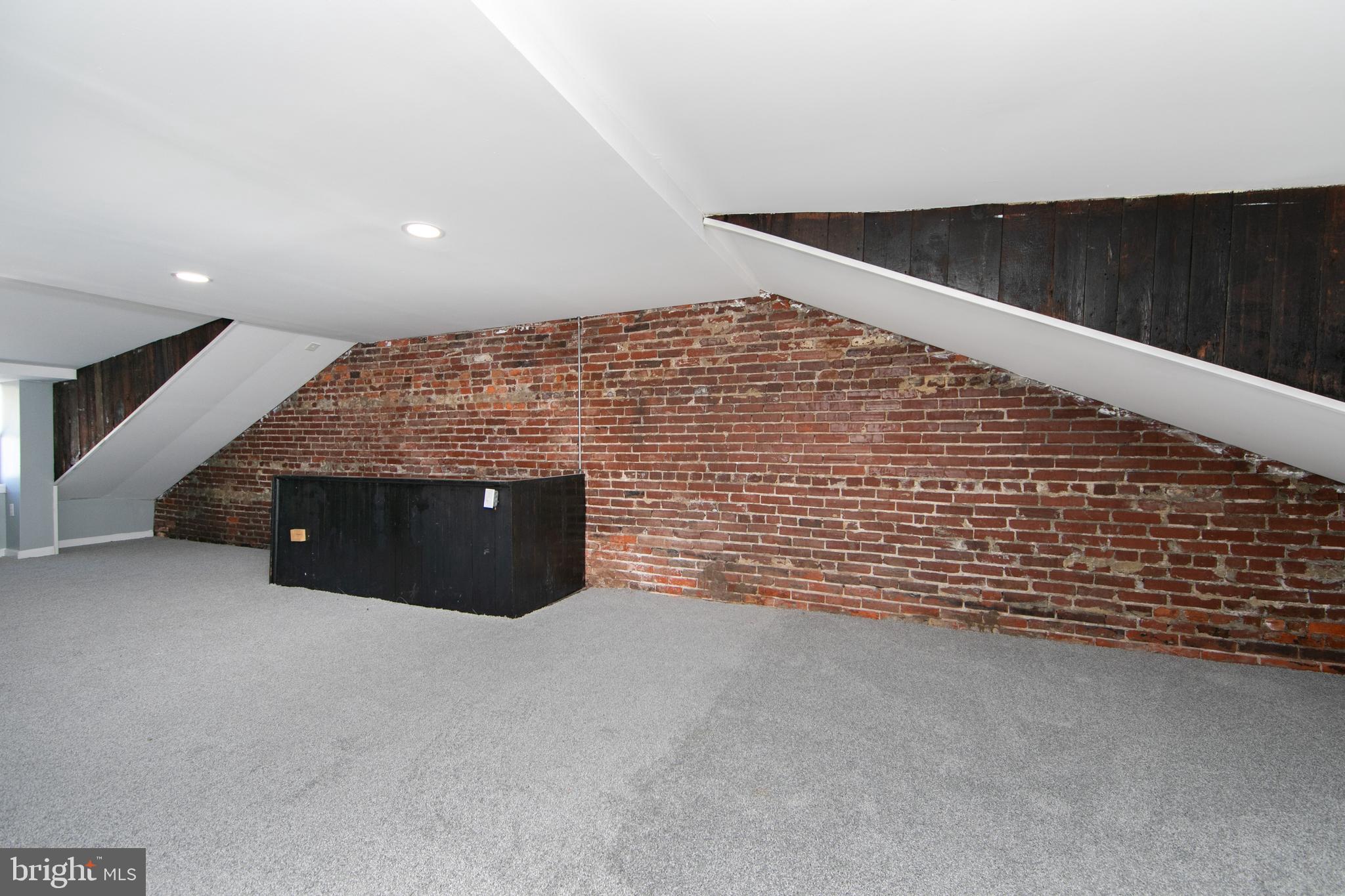 513 Benson Street Camden, NJ 08103 - Photo 32 of 37 a view of an empty room with wooden floor