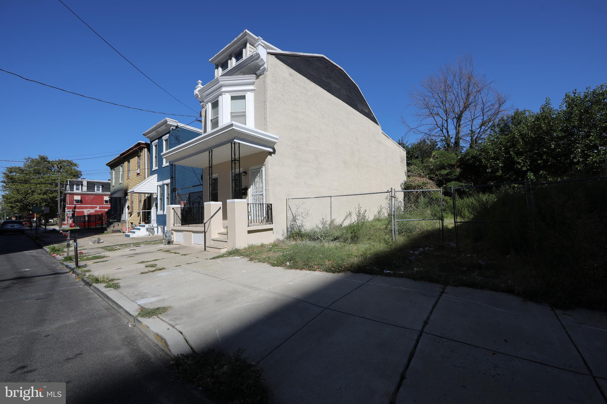 513 Benson Street Camden, NJ 08103 - Photo 36 of 37 a view of a white house with a street
