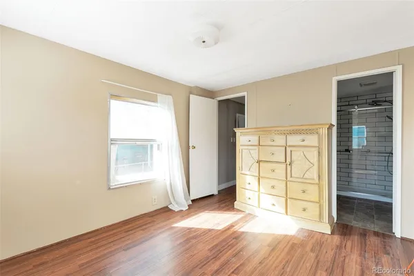an empty room with closet area