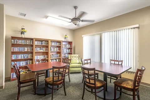 a dining room with furniture and window