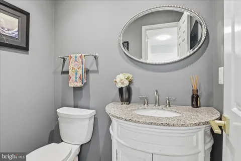 a bathroom with a toilet and a sink