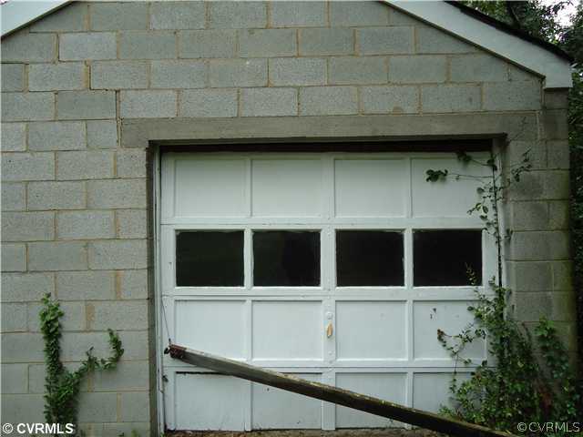Exterior Front - Separate Garage and Shed.  Solid