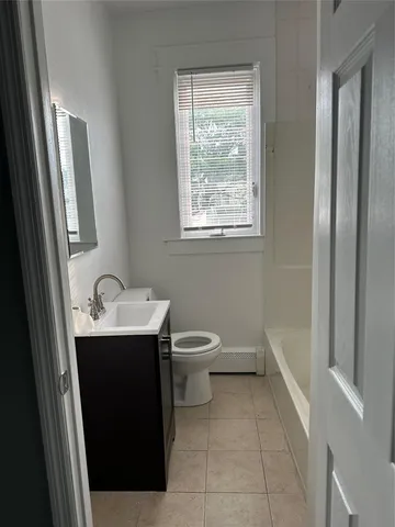 a view of a car parked in front of a house