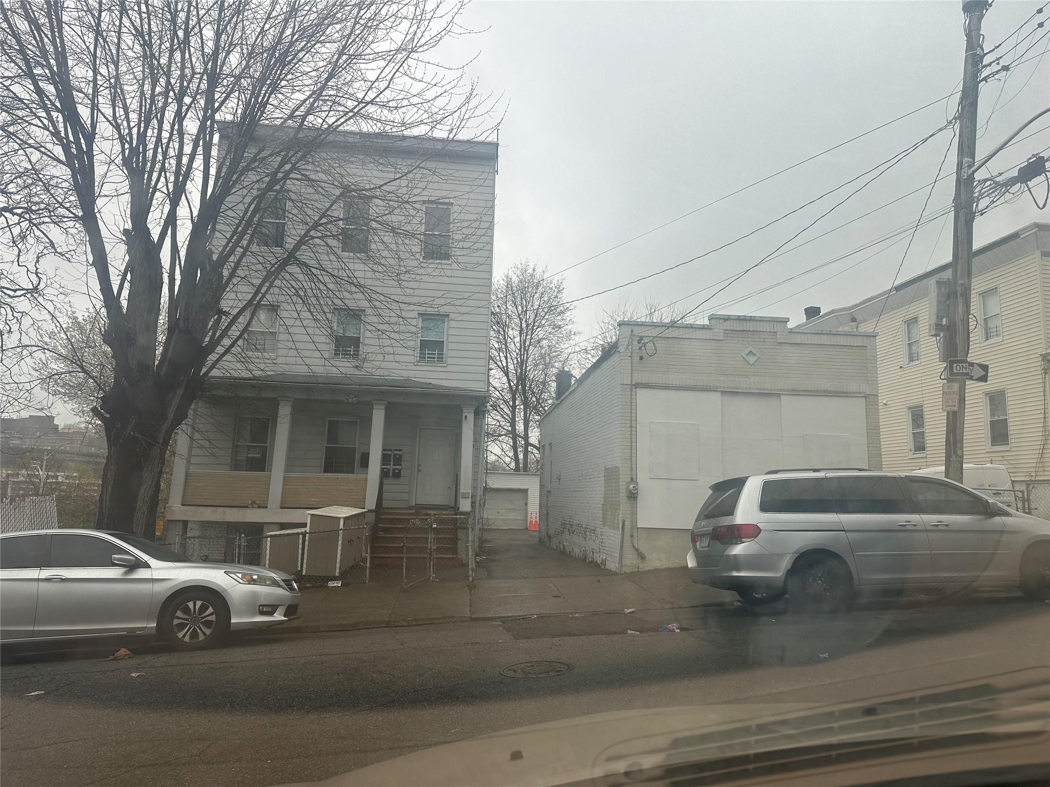 17 Chestnut Street Yonkers, NY 10701 - Photo 15 of 20 a view of a car parked in front of a house