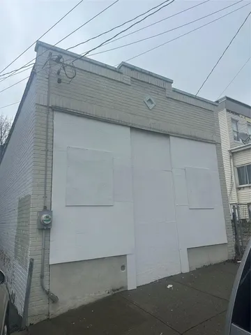 a view of a building with a table and chairs