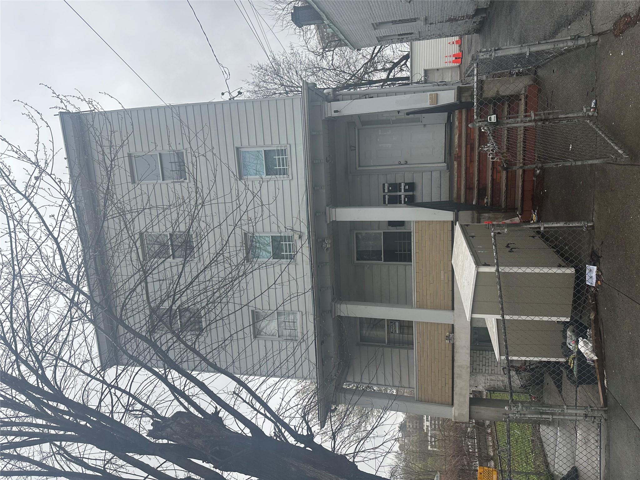 17 Chestnut Street Yonkers, NY 10701 - Photo 18 of 20 a view of a building with a table and chairs