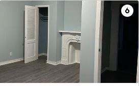 a view of a livingroom with wooden floor