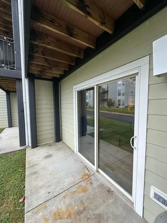 a view of backyard with porch