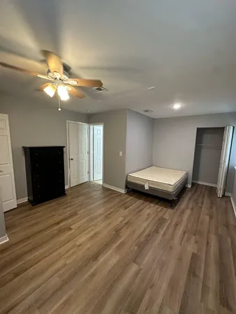 a view of livingroom with furniture and chandelier fan