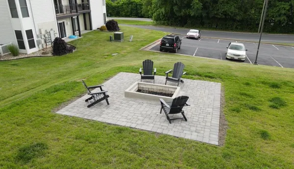 a view of a backyard with sitting area