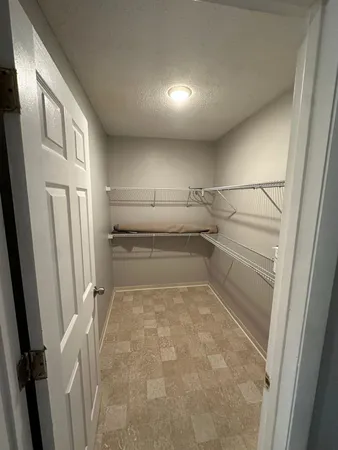 a view of a room with racks on the wall