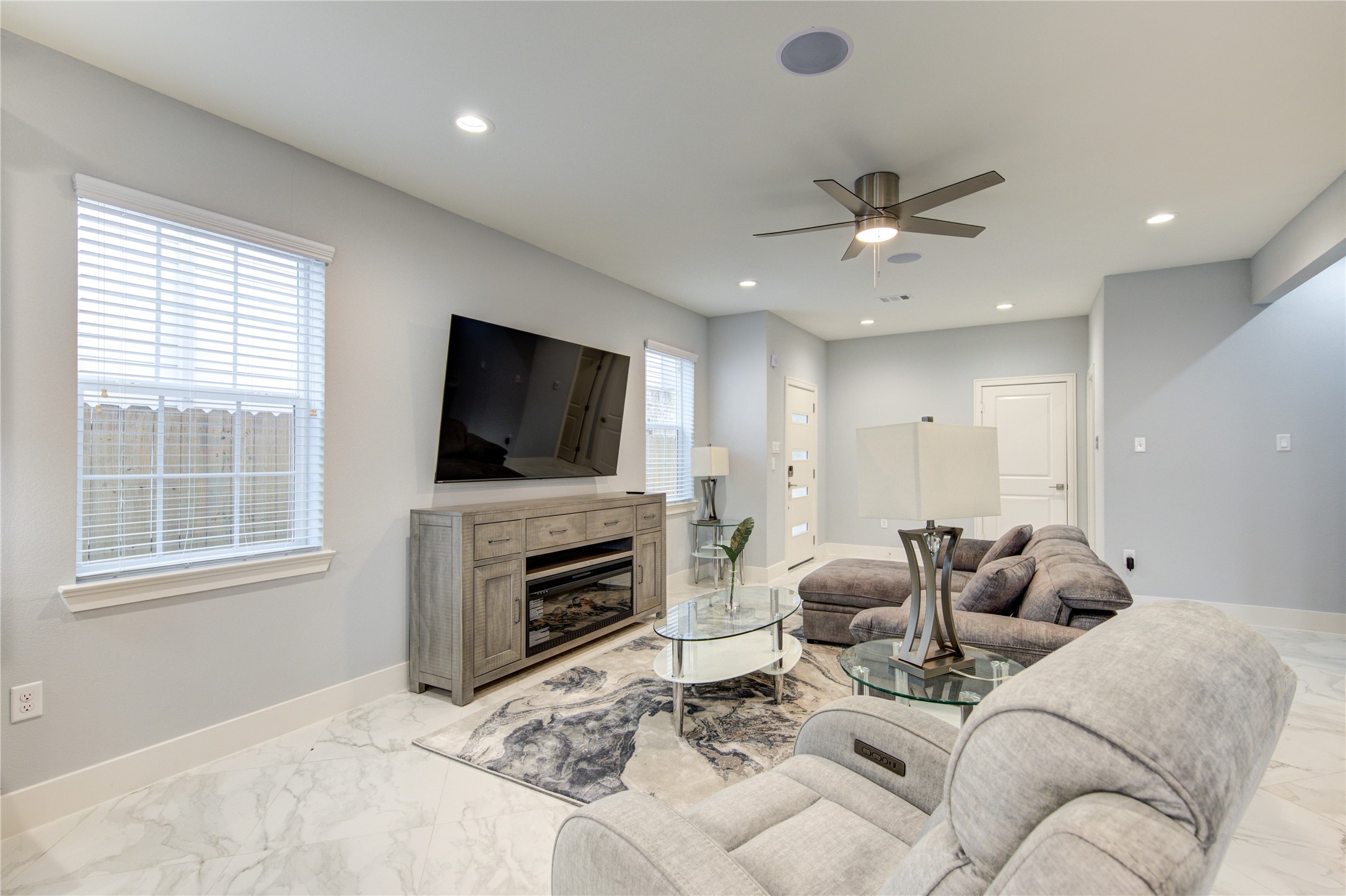 10021 Alfred Lane, Unit B Houston, TX 77041 - Photo 15 of 46 a living room with furniture a flat screen tv and a fireplace
