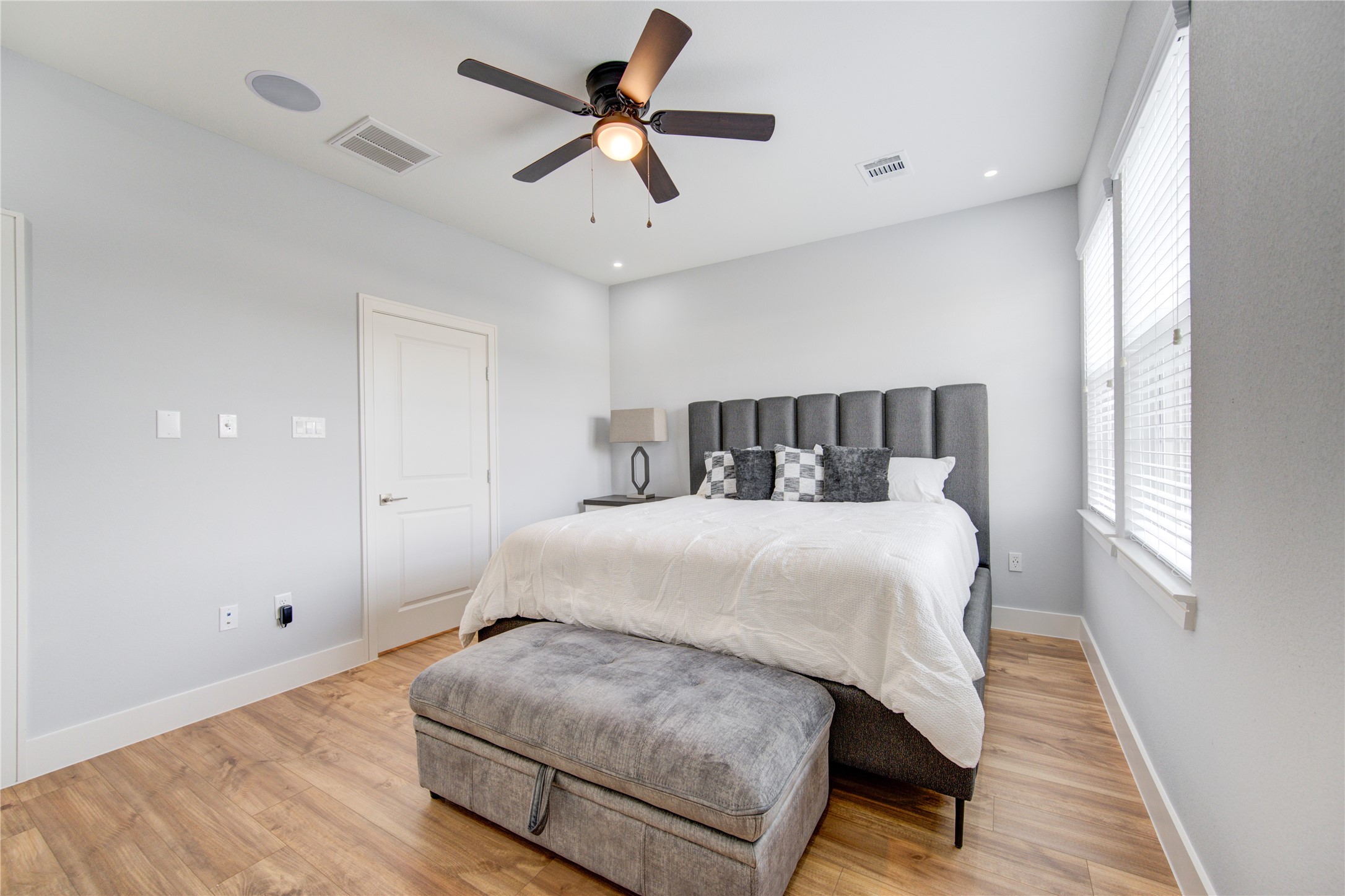 10021 Alfred Lane, Unit B Houston, TX 77041 - Photo 22 of 46 a bedroom with a bed and wooden floor