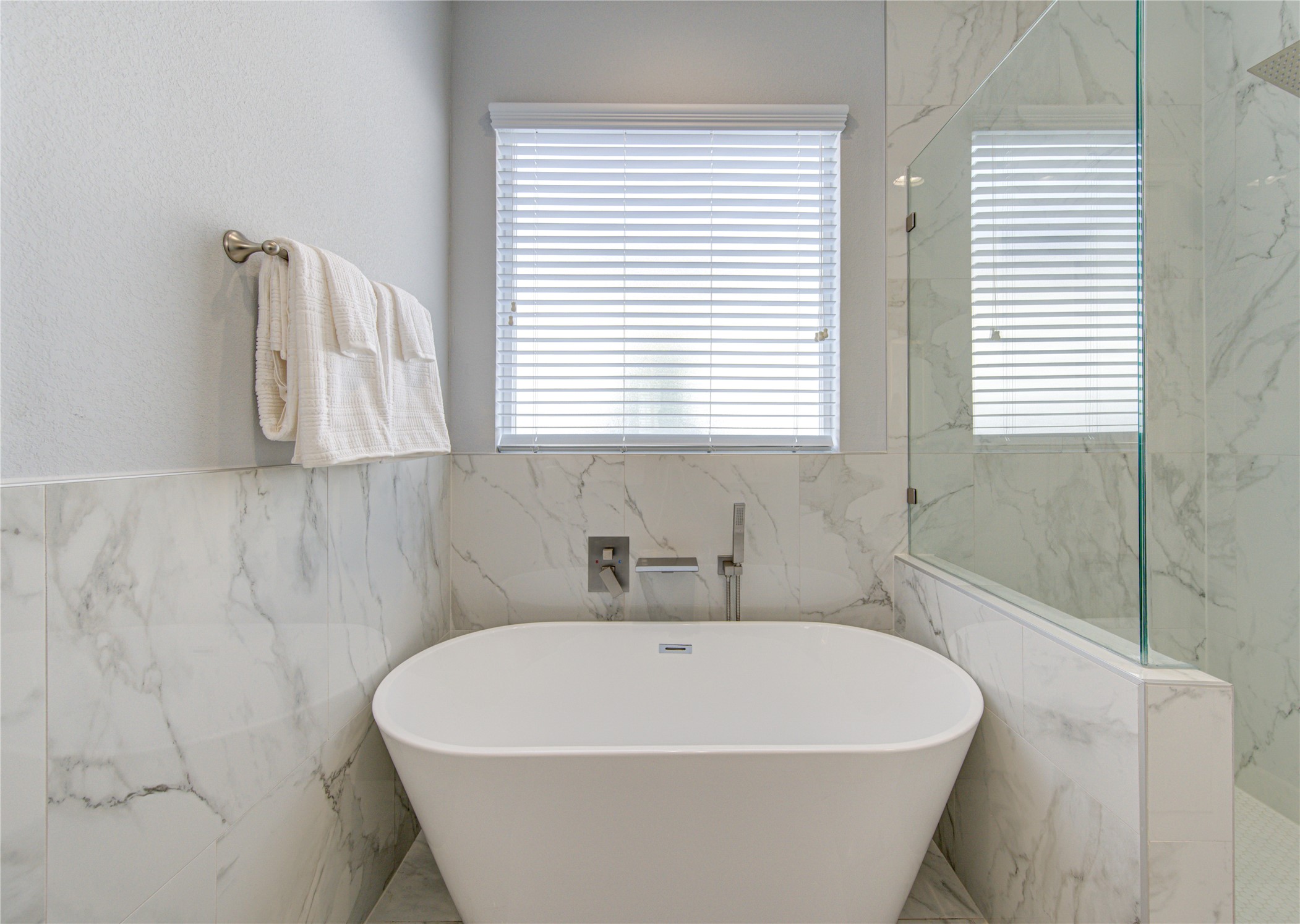 10021 Alfred Lane, Unit B Houston, TX 77041 - Photo 23 of 46 a white bath tub sitting in a bathroom next to a window